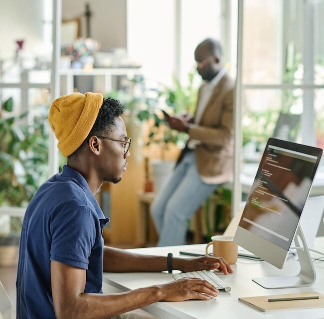 [fpdl.in]_african-man-writing-code-new-software_249974-14500_large