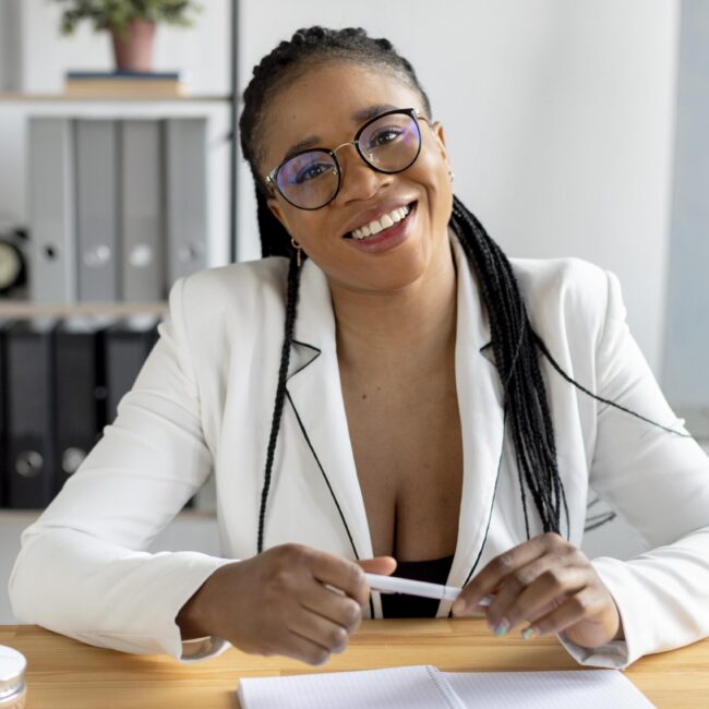 medium-shot-smiley-woman-desk